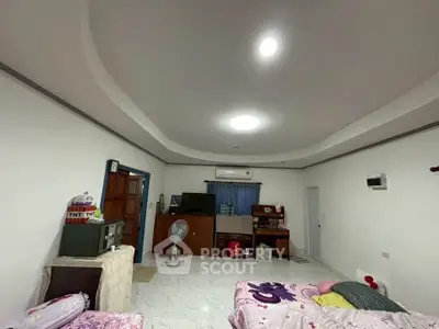 Spacious living room with modern ceiling design and cozy furnishings