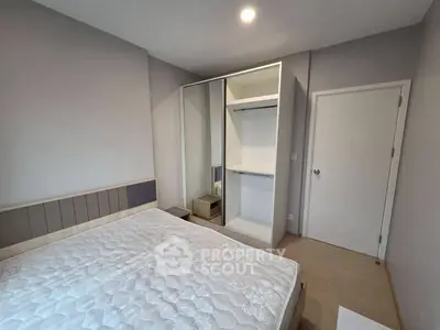 Modern bedroom with minimalist design and spacious wardrobe