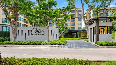 Modern condominium entrance with lush landscaping in Cha Am Hua Hin