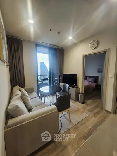 Modern living room with cozy sofa and city view balcony