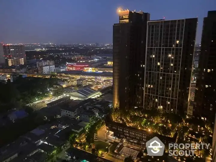 Captivating twilight view of a modern high-rise residential building with illuminated balconies, set against a bustling cityscape backdrop.