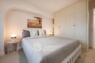 Cozy bedroom with modern decor and ample storage space