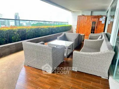 Spacious balcony with modern outdoor furniture and city view