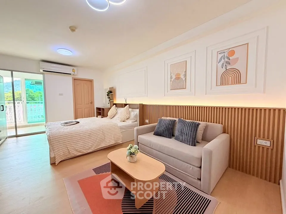 Spacious studio apartment with modern decor and natural light
