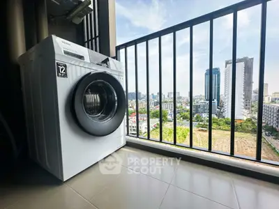 Modern washing machine on balcony with stunning city view