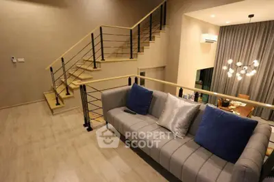 Modern duplex living room with stylish staircase and elegant decor