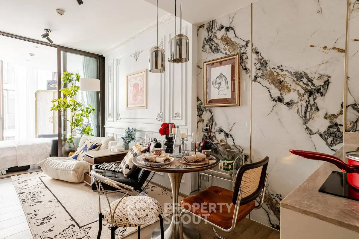 Luxurious open-plan living room with elegant marble accents and stylish dining area