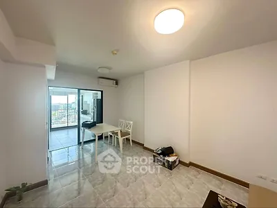 Spacious living room with balcony view in modern apartment