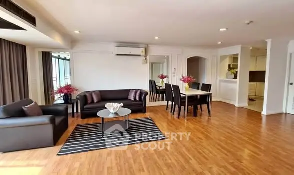 Spacious living room with modern furniture and open layout, perfect for entertaining.