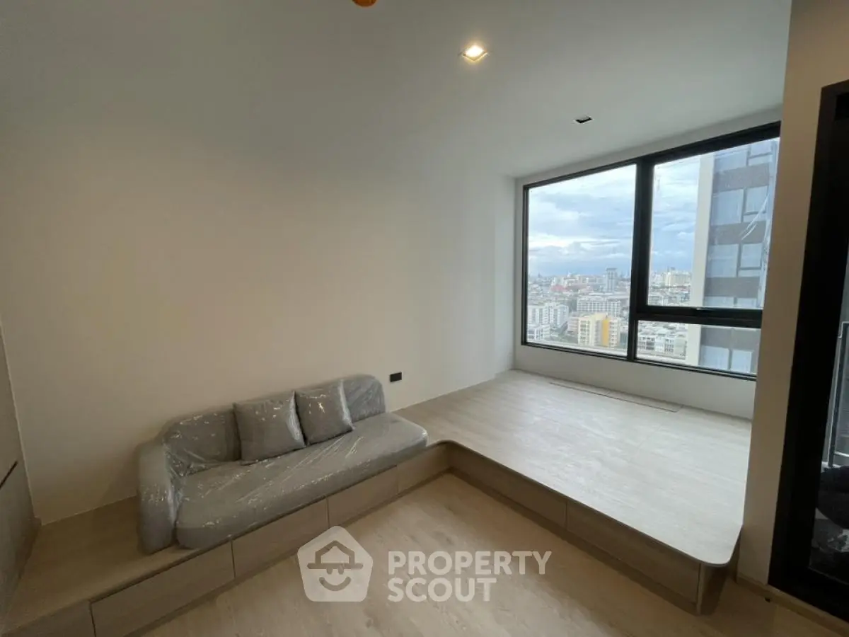 Modern living room with panoramic city view and sleek minimalist design