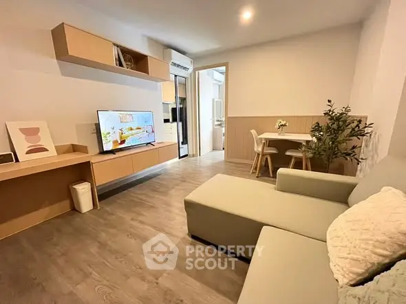 Modern living room with stylish furniture and open layout, perfect for cozy gatherings.