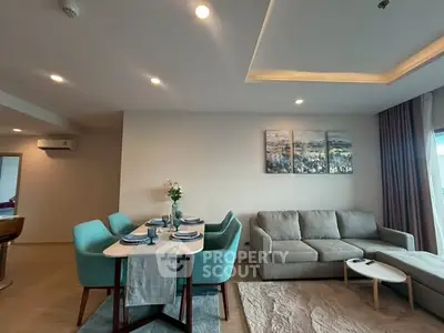 Modern living room with stylish dining area and cozy seating, perfect for entertaining.