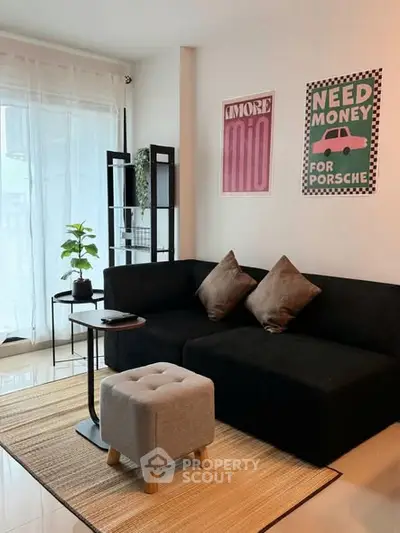 Stylish living room with modern decor and cozy seating area.