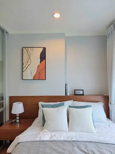 Modern bedroom with stylish decor and natural light