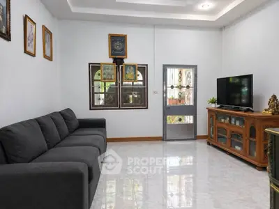 Spacious living room with elegant decor and ample natural light