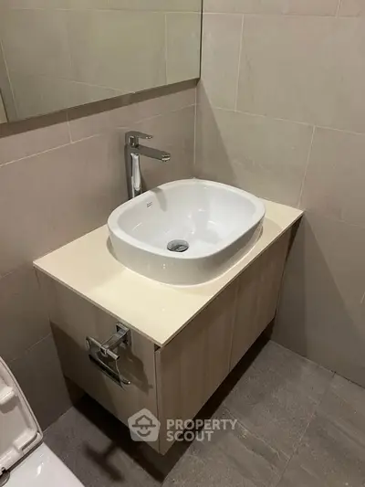 Modern bathroom with sleek sink and elegant tile design