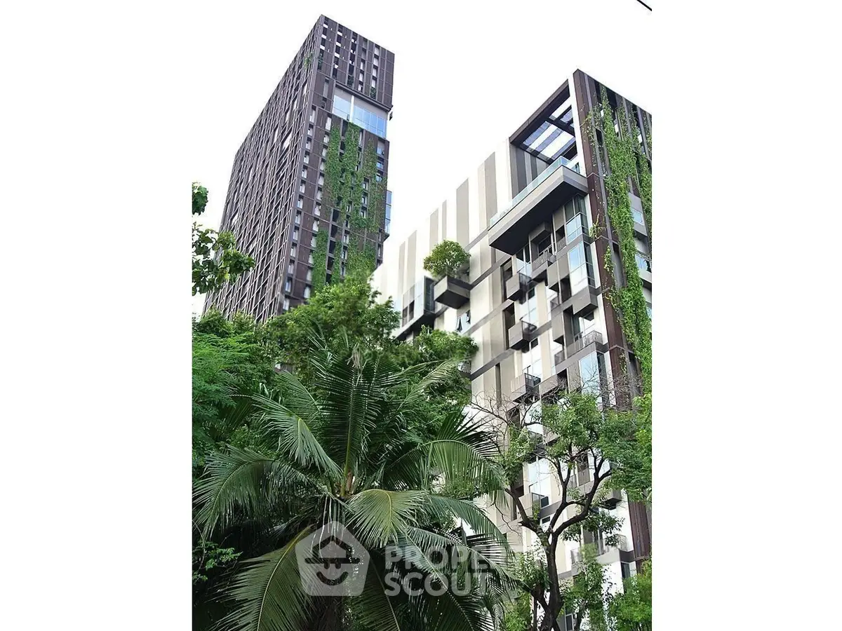 Modern architectural building with lush greenery and vertical gardens