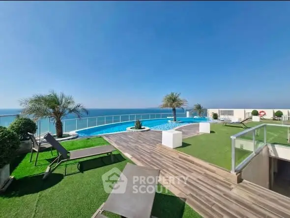 Luxurious rooftop pool with stunning ocean view and modern lounge area.