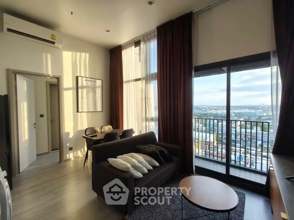 Modern living room with stunning city view and floor-to-ceiling windows