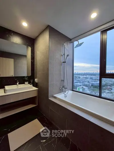 Luxurious bathroom with city view, featuring a modern bathtub and elegant fixtures.