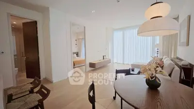 Spacious modern living room with elegant dining area and natural light