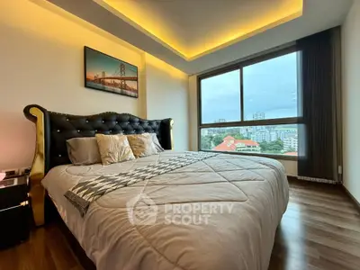 Luxurious bedroom with elegant decor and city view from large window
