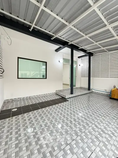 Modern tiled patio with sleek design and covered roof