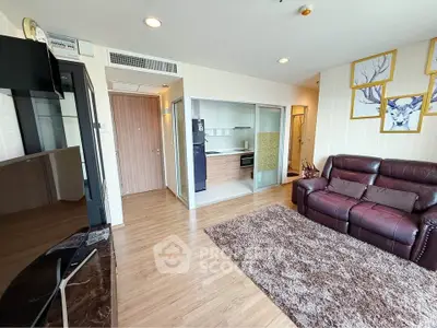 Spacious living room with modern decor and open kitchen layout
