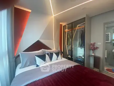 Modern bedroom with geometric wall design and stylish decor