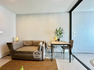 Modern living room with stylish sofa and dining area in open layout