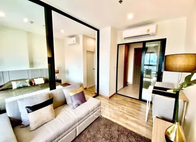 Modern living room with cozy sofa and stylish decor in a bright apartment