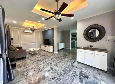 Spacious modern living room with marble flooring and ceiling fan