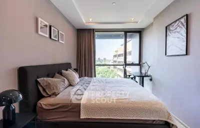 Modern bedroom with large window and stylish decor in urban apartment