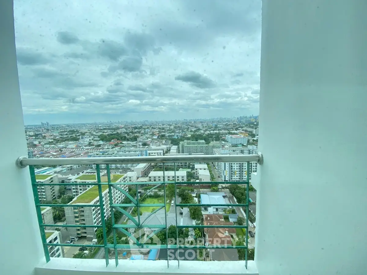 Stunning cityscape view from high-rise balcony, perfect for urban living enthusiasts.