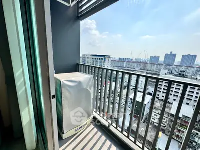 Stunning city view from a modern balcony with sleek railing design.
