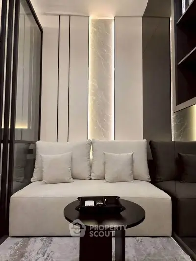 Modern living room with sleek design and cozy seating area