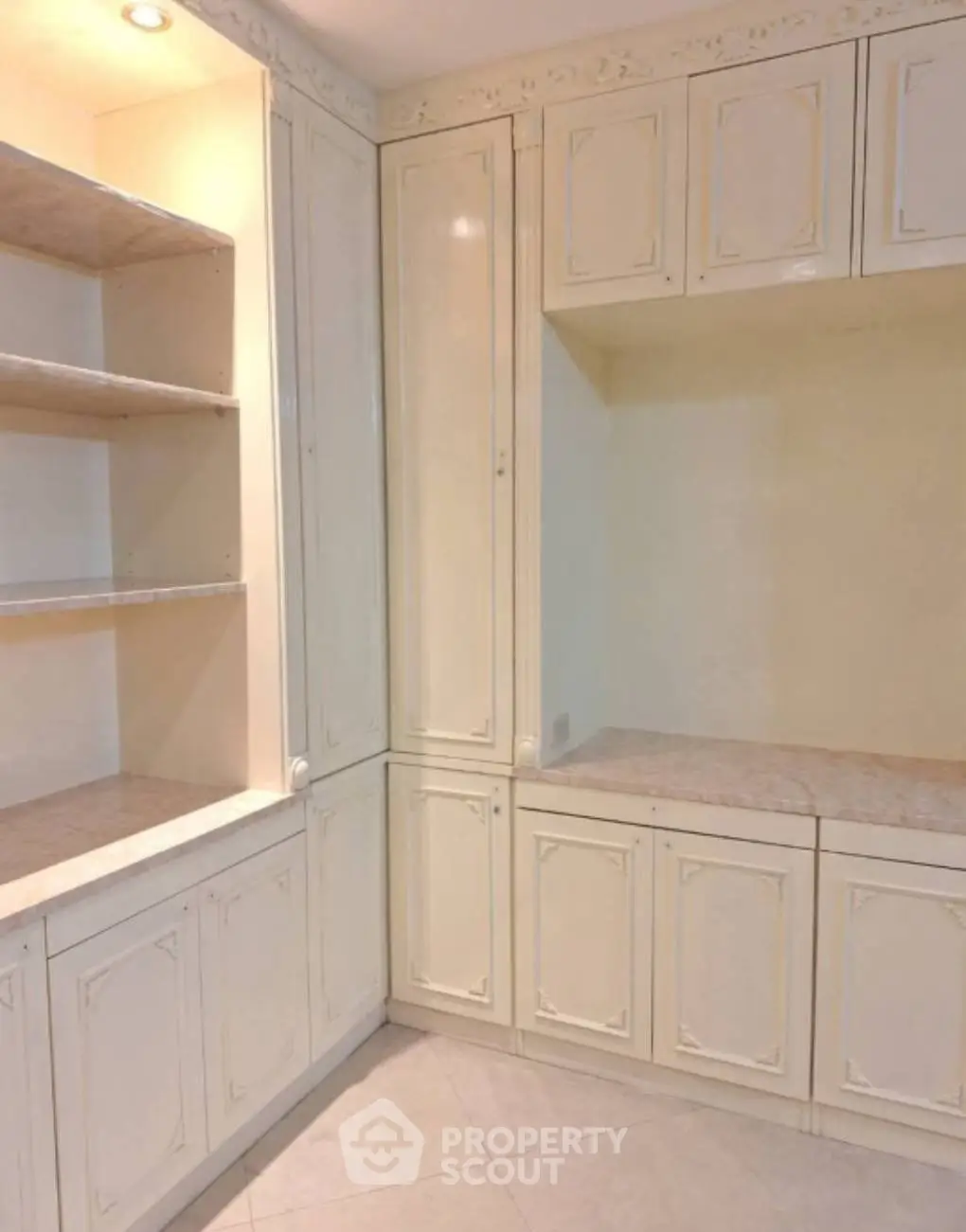 Spacious storage area with elegant cabinetry and ample shelving
