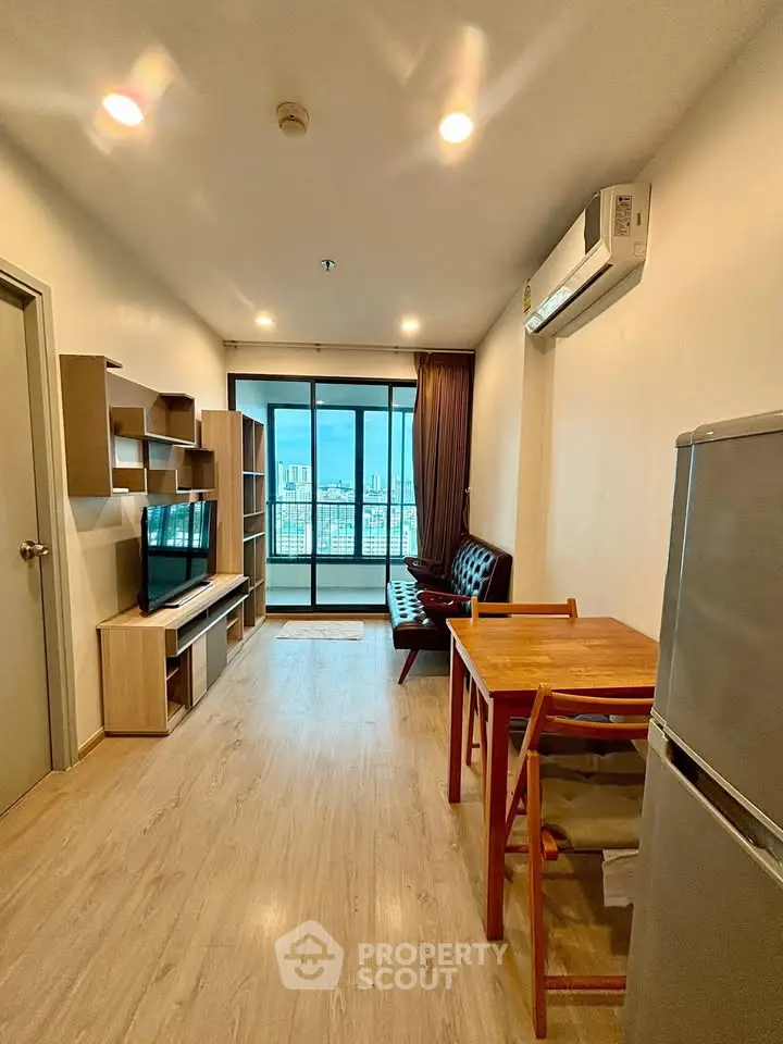 Modern living room with city view, featuring sleek furniture and open layout for comfortable urban living.