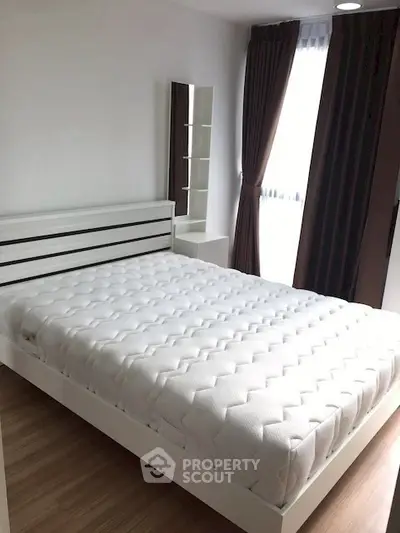 Modern bedroom with stylish bed and large window for natural light