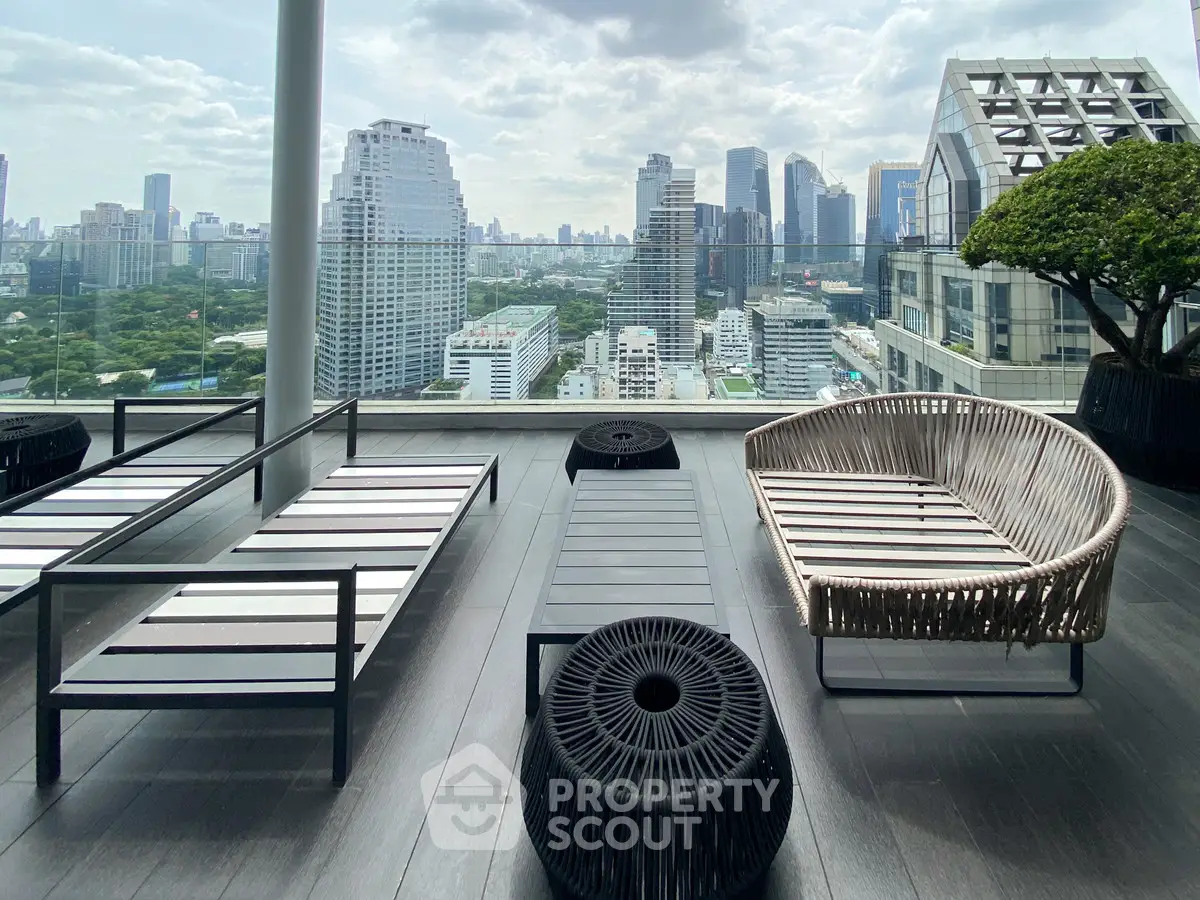 Stunning rooftop terrace with modern seating and panoramic city skyline views.