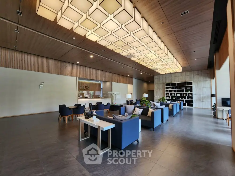 Luxurious modern living room with elegant seating and unique ceiling design