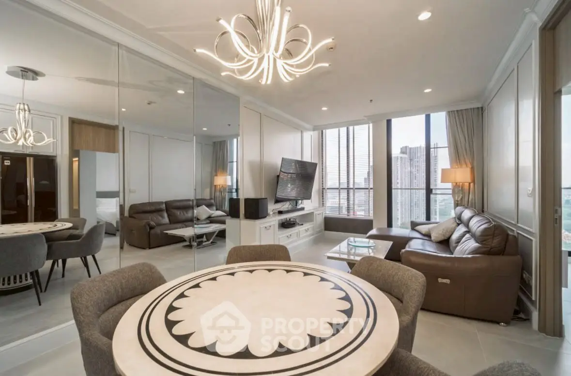 Luxurious modern living room with elegant chandelier and city view