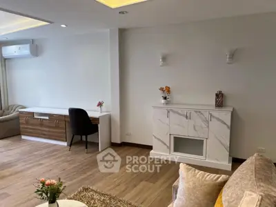 Spacious modern living room with elegant decor and wooden flooring
