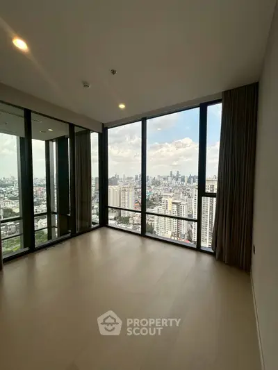 Spacious corner unit with floor-to-ceiling windows offering stunning city views.