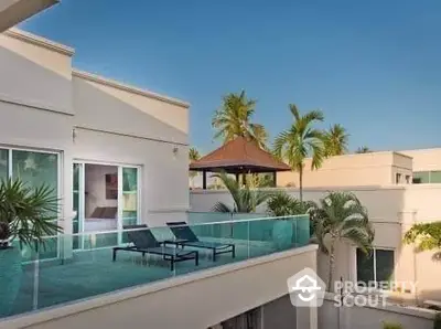 Luxurious modern villa with spacious balcony and tropical garden view