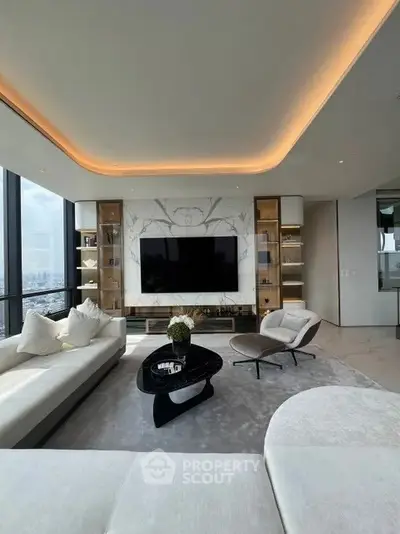 Luxurious modern living room with panoramic city views and elegant decor.