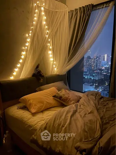 Cozy bedroom with city view and ambient lighting