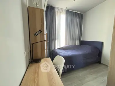 Cozy bedroom with modern decor and ample natural light