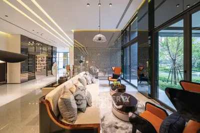 Luxurious modern living room with floor-to-ceiling windows and elegant decor.