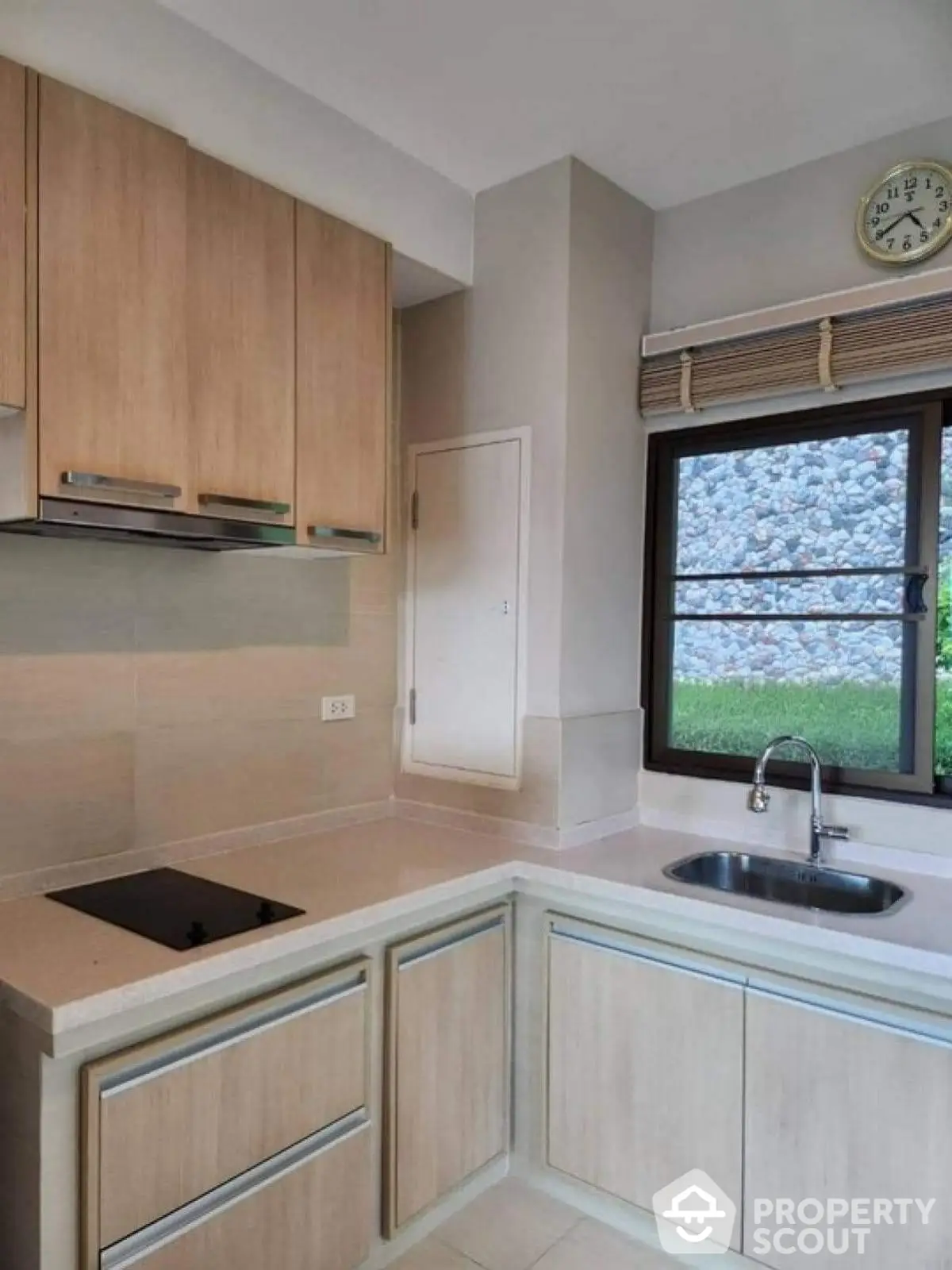 Modern kitchen with sleek cabinetry and large window view